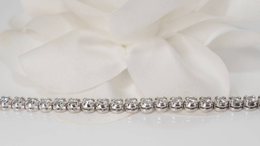 Bracelet Bracelet rivière en or blanc et diamants sertis clos 58 Facettes 31743