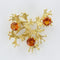 Broche Broche rétro grenats oranges 58 Facettes 20-076